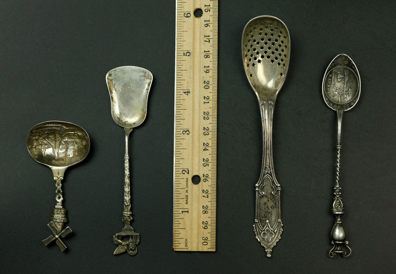 4 antique sterling silver small spoons. marked (1 of 7)