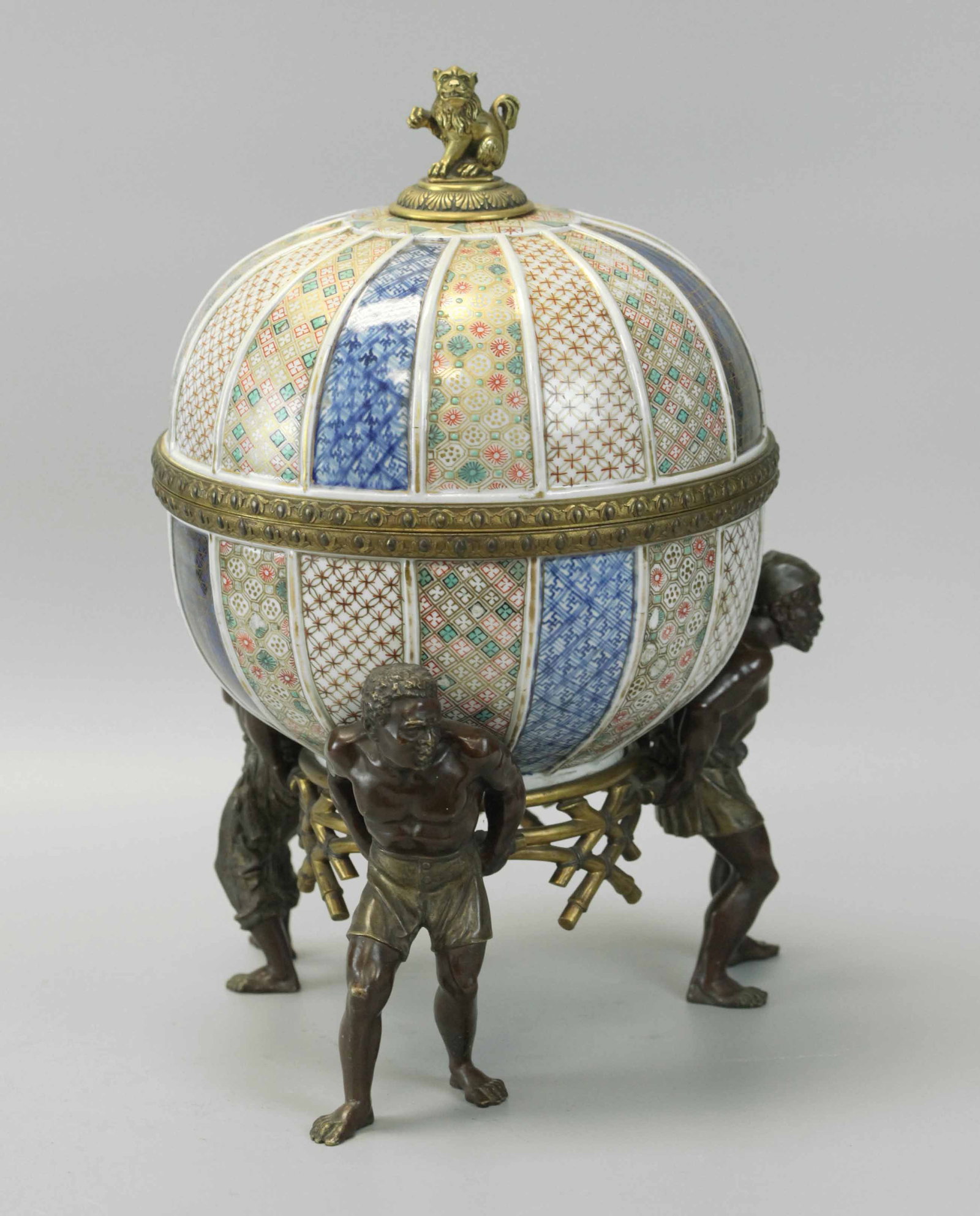 19th century Chinese porcelain centerpiece bowl with French bronze blackmoor base.: 19th century Chinese porcelain centerpiece bowl with French bronze blackmoor base. 10``x14``