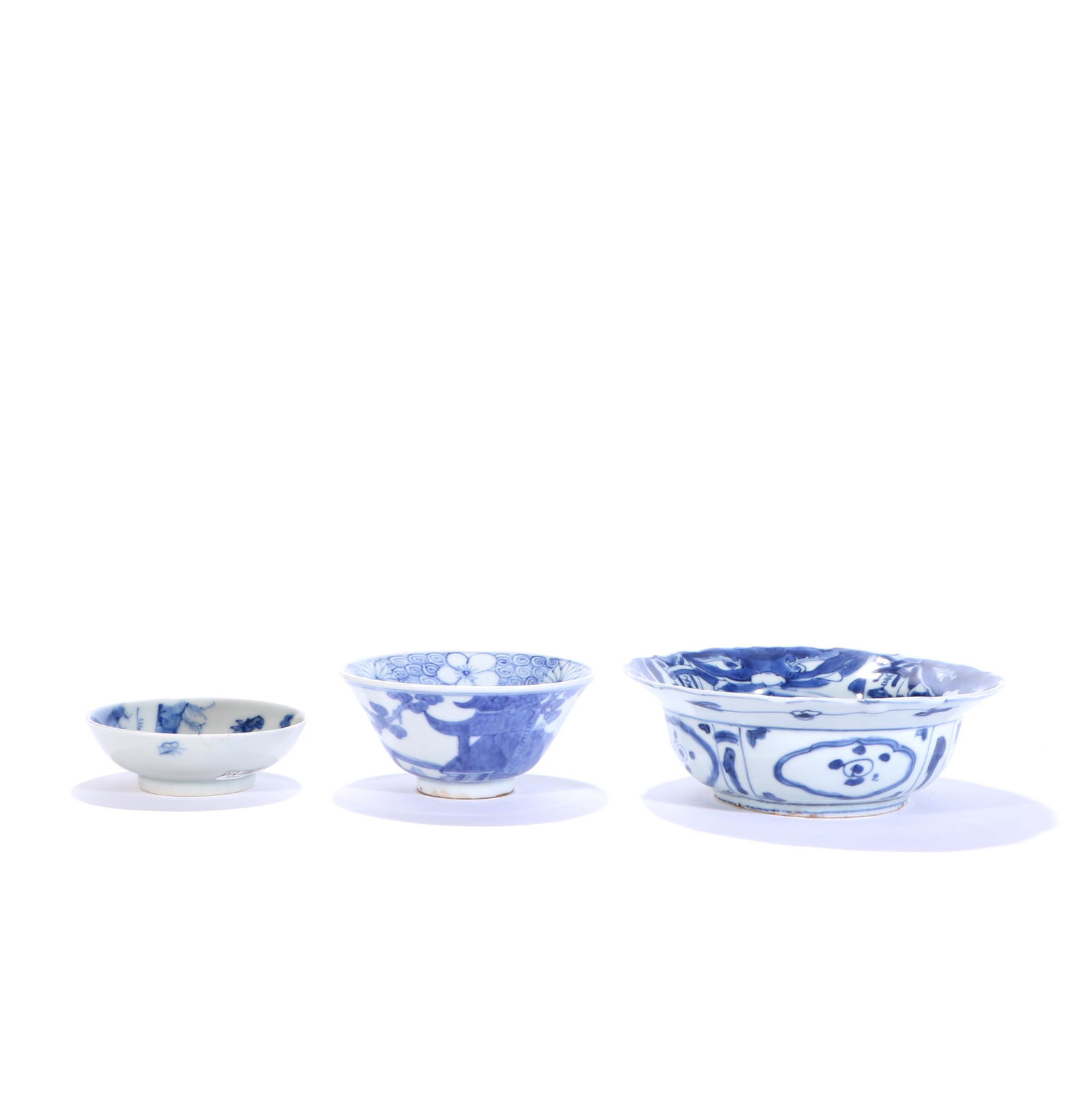 A set of blue and white bowls and cups: different sizes