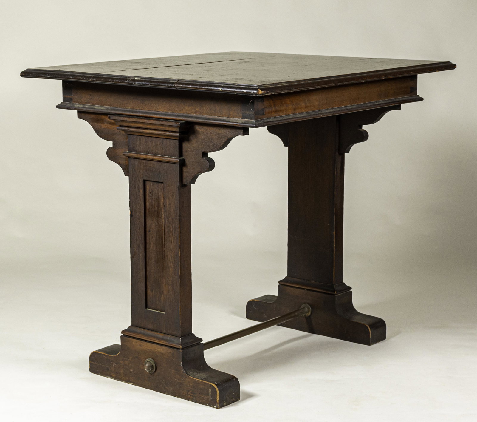 Classical Mahogany Writing Table: American, ca. 1900. The top with dovetail construction, central stretcher with brass rod below, 30.25 x 33 x 29.75"