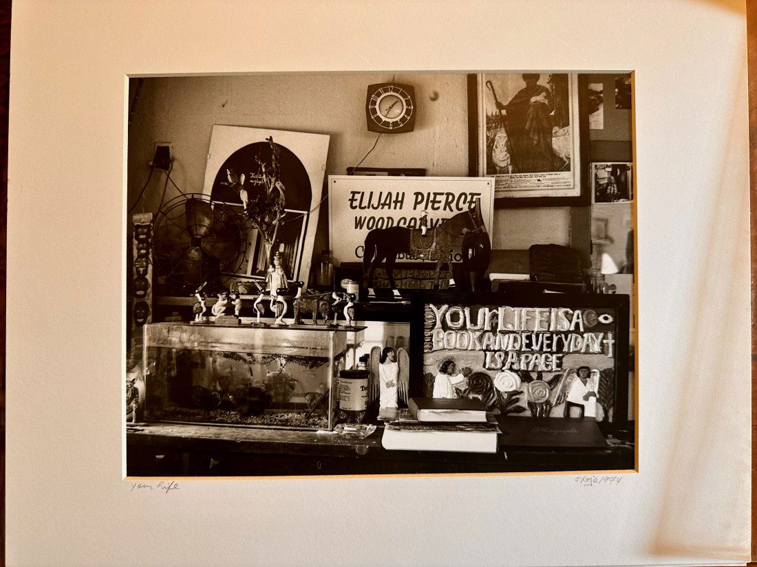 Unique African American Photographer Kojo Kamau Signed..Elijah Pierce Photo: African American Photographer Kojo Kamau Signed..Elijah Pierce Photo, signed in pencil lower right, dated 1974, titled, "Your Life", signed and dated verso, 8 x 10", 11 x 14" mat. (American, 1939 - 20