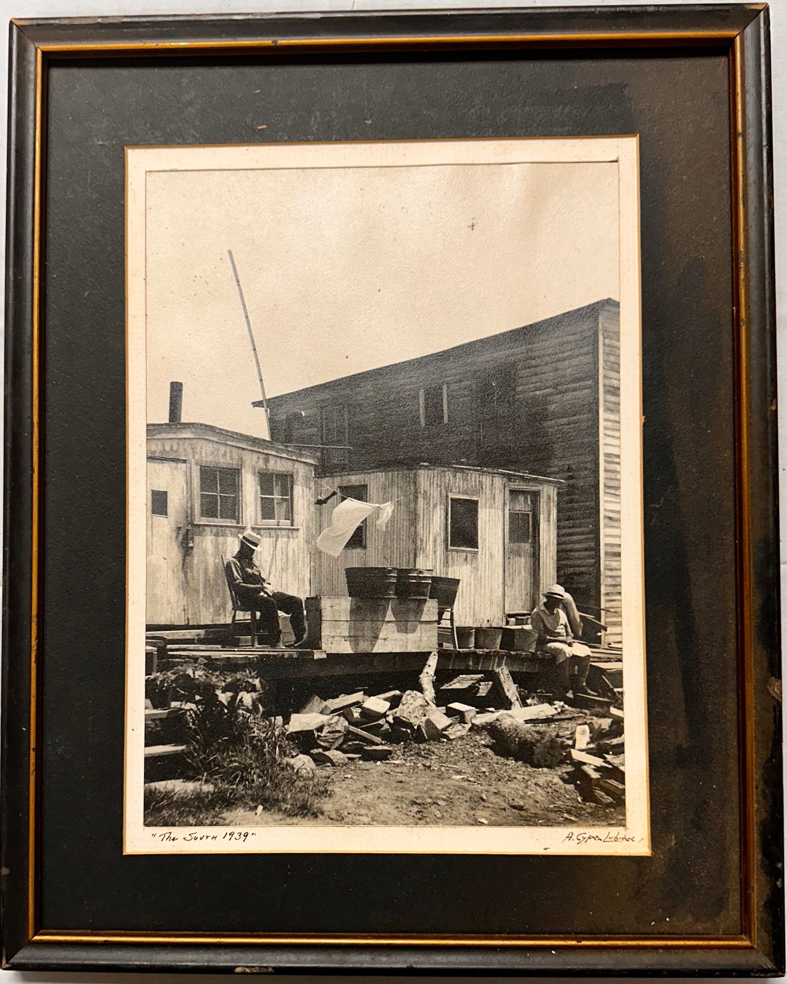 Aron Cypen Lubitsh WPA Era Photograph of the South Signed: Aron Cypen Lubitsh WPA Era Vintage Photograph of the South showing an African American gentleman seated on the front steps to his house, Signed, 9 1/2 x 7 1/2" image size, 15 x 12" overall One photogr