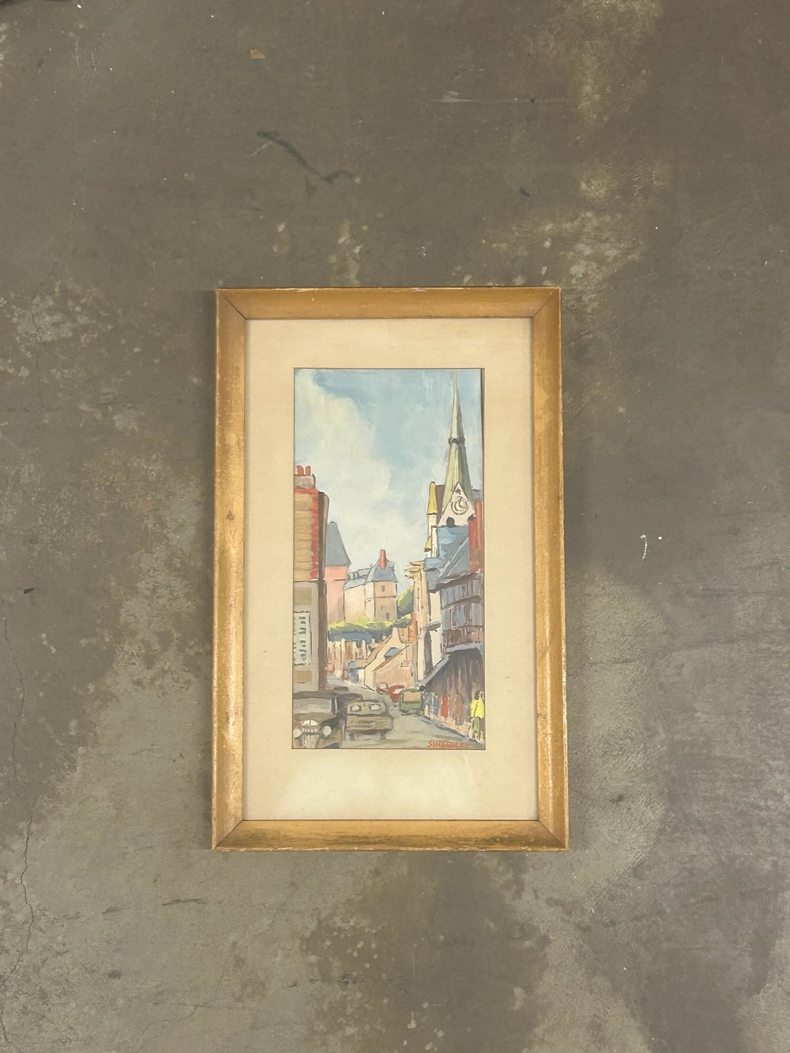 Vintage Impressionist Raymond Simonin European Street Scene Signed Gouache: This delightful vintage cityscape captures the essence of a bustling European street, complete with classic architecture, colorful façades, and lively urban movement. A church spire rises above the c