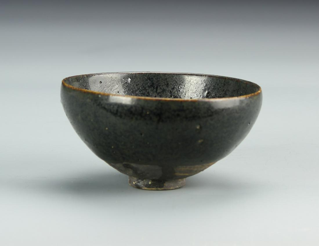 Chinese Antique Black Glazed Bowl: China, antique black glazed bowl. Dimensions 4 x 1 3/4 in.