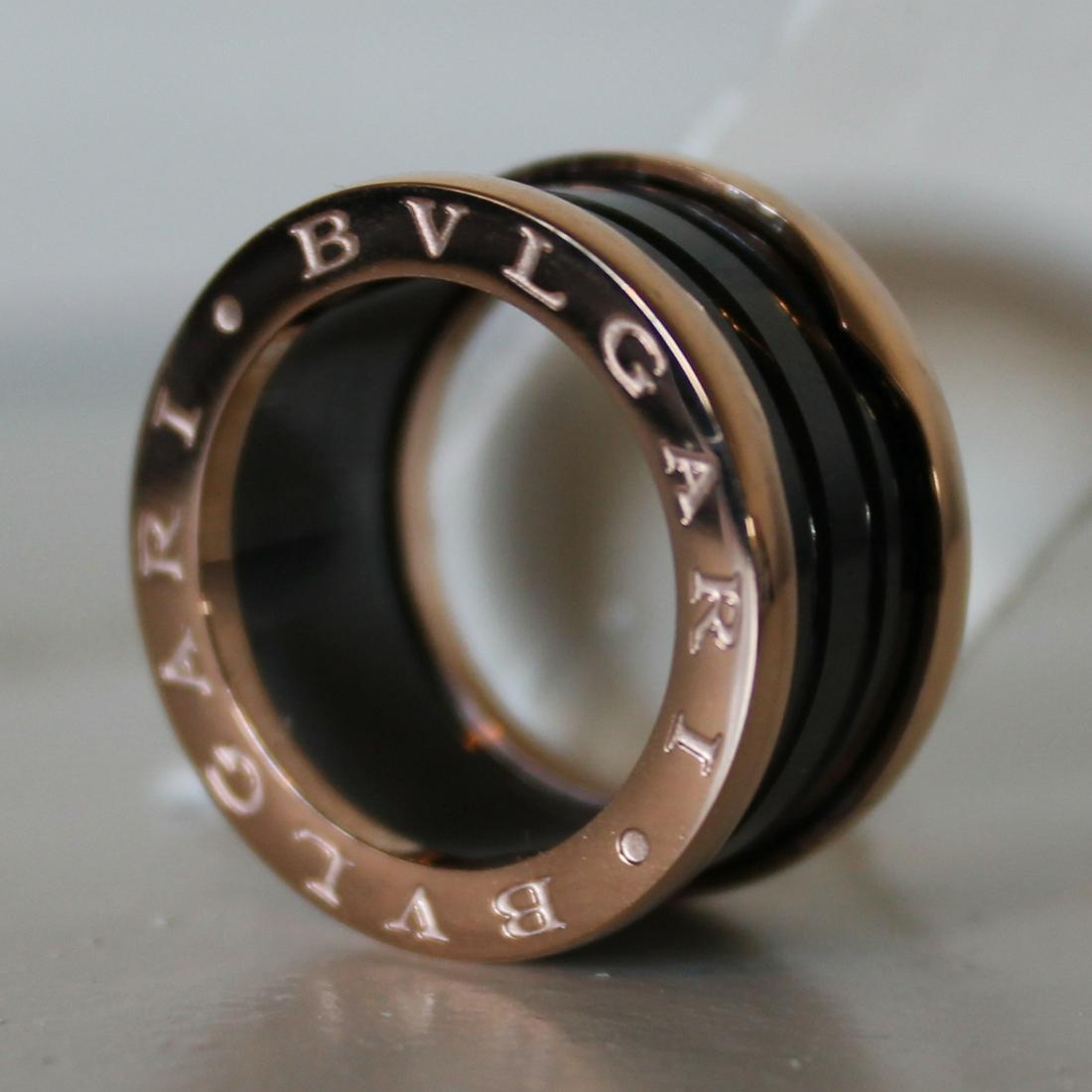 Bvlgari Layered Band Ring Black Rose Gold: DESCRIPTIONBvlgari Layered Band collection ringRing size: 7Material: Rose GoldFour band versionIncludes Bvlgari ring box