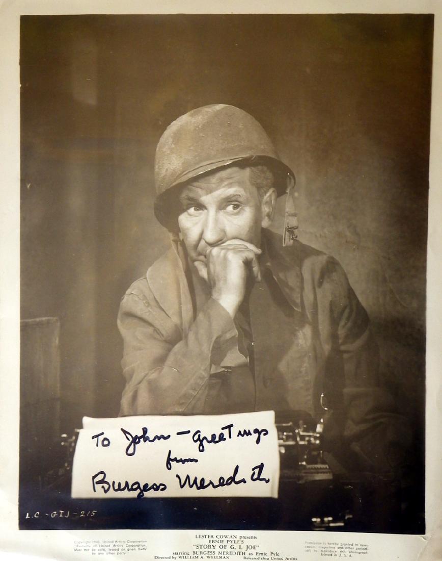 Actor BURGESS MEREDITH - Movie Photo Signed: Burgess Meredith. 8” x 10” black and white promotional movie still from his 1945 film, Story of G.I. Joe, signed “To John – greetings from Burgess Meredith”. Some wrinkling and damage to the