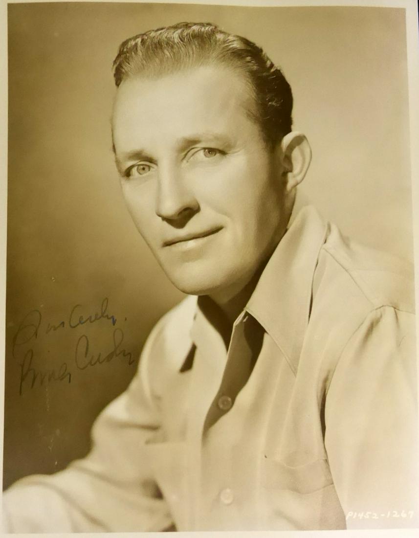 Crooner BING CROSBY - Photo: Bing Crosby. 7 ¾” x 9 ¾” matte finish, sepia toned photograph signed, “Sincerely Bing Crosby”.