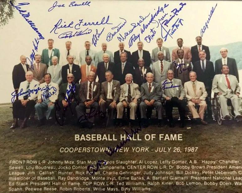 1987 HOF Induction - Photo Signed by 20 Members: 1987 Cooperstown Reunion Photo signed by twenty returning Hall of Famers. This is a 14” x 11” color photo singed by; Ted Williams, Jim Hunter, Joe Sewell, Rick Ferrell, Ralph Kiner, Bob Lemon, Bob