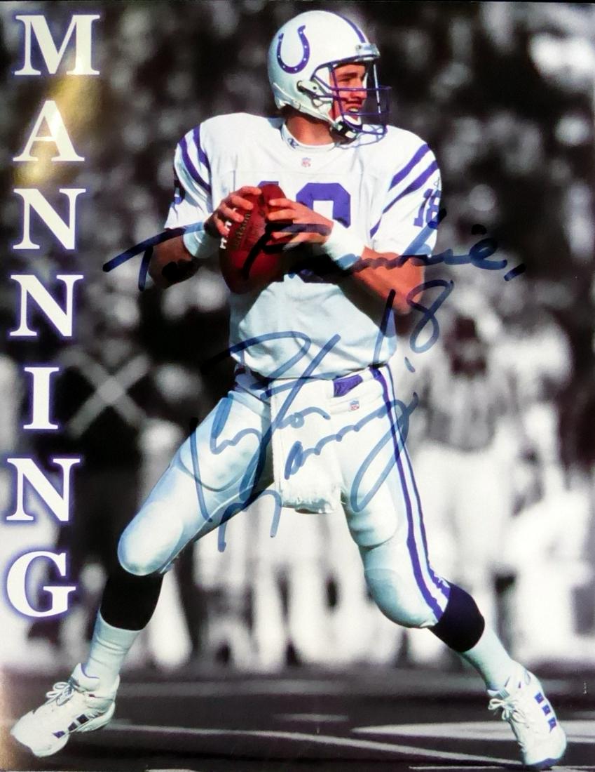 Quarterback PEYTON MANNING - Photo Signed: Peyton Manning (1976- ) Quarterback. Manning played 18 seasons in the NFL, primarily with the Indianapolis Colts. Considered to be one of the greatest quarterbacks of all time due to his numerous care