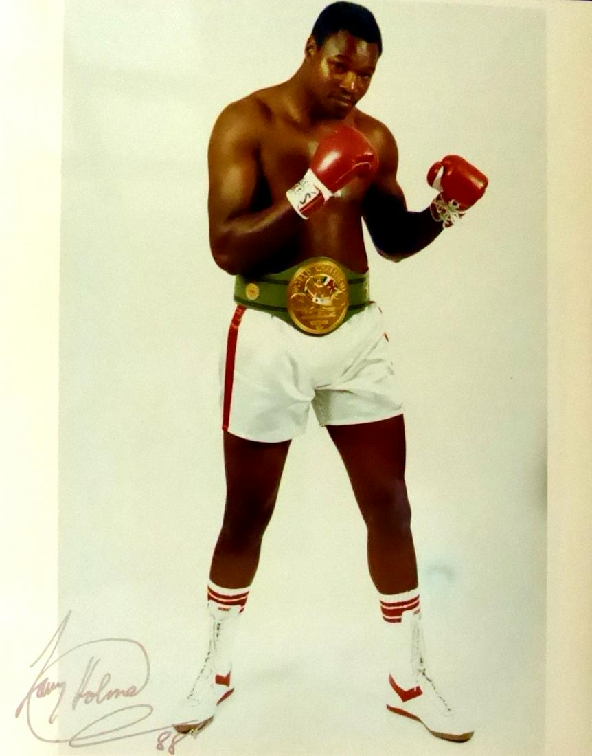 Hvywght Champ LARRY HOLMES - Photo: Larry Holmes (1949- ) Heavyweight Boxing Champion. Holmes hose left jab is rated among the best in boxing history,[1] held the WBC heavyweight title from 1978 to 1983, The Ring magazine and lineal hea