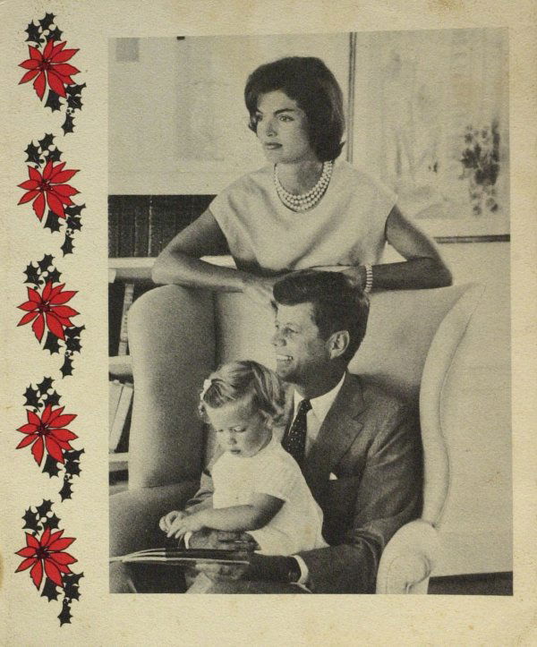 Senator JOHN KENNEDY & Family - Christmas Card: (John F. Kennedy) An early 4 ¾" x 5 ¾" Christmas card, with the Senator, Mrs. Kennedy and Caroline pictured on the front, and a gold embossed United States seal, signed by autopen, "Best – Jack."