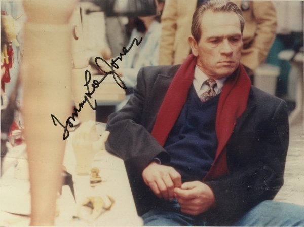 Actor TOMMY LEE JONES - Color Photo Signed: Tommy Lee Jones (1946- ) Actor. Jones is perhaps best known for his appearances as Samuel Gerard on The Fugitive and U.S. Marshals, as Woodrow F. Call in the Lonesome Dove series and as Sheriff Ed Tom
