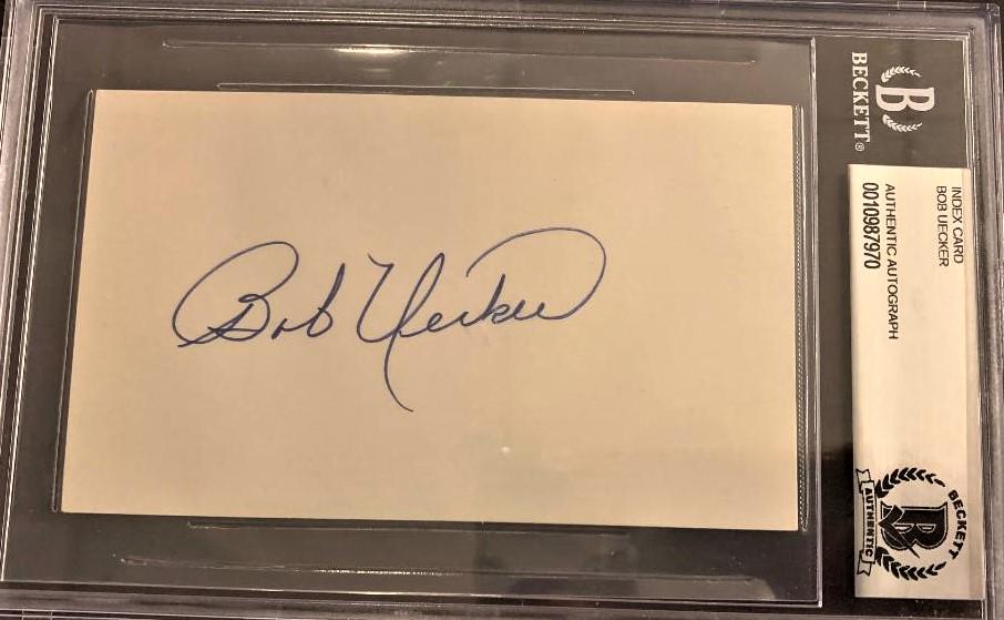 Uecker,Bob Signed/Encapsulated Card: Robert George Uecker (1934-) is an American former Major League Baseball (MLB) player and current sportscaster, comedian, and actor. Facetiously dubbed "Mr. Baseball" by TV talk show host Johnny Carso