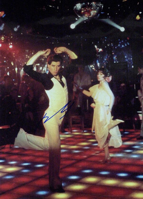 John Travolta - Saturday Night Fever Photo: John Travolta (1954- ) Actor. Travolta first became known in the 1970s, after appearing on the television series Welcome Back, Kotter and starring in the box office successes Saturday Night Fever and