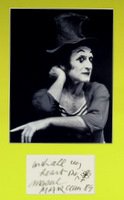 French Mimi MARCEL MAECEAU - Card with Photograph: Marcel Marceau. 4 ½” x 2 ¾” card signed, “With all my heart one Marcel Marceau 89,” matted with an 8” x 10” black and white photograph to 11” x 14”.
