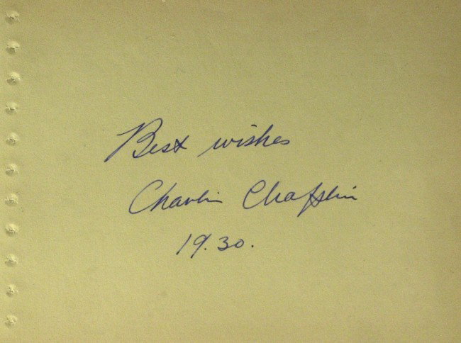 Classic Comedian CHARLIE CHAPLIN - Album Signed: Charlie Chaplin. 6" x 4 ½" album page signed, "Best wishes Charlie Chaplin 1930." Includes an 8" x 10" color photograph of the lobby card from his film, Charley's Nightmare.