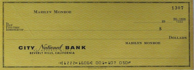 Actress MARIYN MONROE - Check From Her Account: (Marilyn Monroe). 8 ¼" x 3" blank check from her personal account and an unsigned 10" x 8" promotional black and white photograph from her 1954 film, Asphalt Jungle.