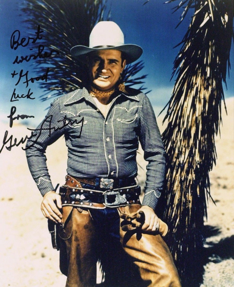 Singing Cowboy GENE AUTRY - Color Photo Signed: Gene Autry (1907-1998) Singer, actor. Autry gained fame as "The Singing Cowboy" on the radio, in movies and on television for more than three decades beginning in the 1930s. Autry was also owner of th
