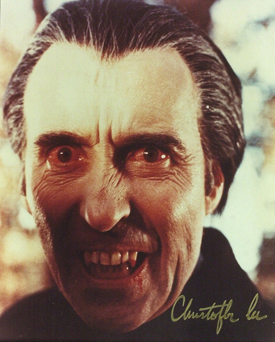 CHRISTOPHER LEE - Sinister Color Photo Signed: Christopher Lee (1922- ) British actor. Lee initially portrayed villains and became famous for his role as Count Dracula in a string of Hammer Horror films. He has performed in two hundred and sixty-s