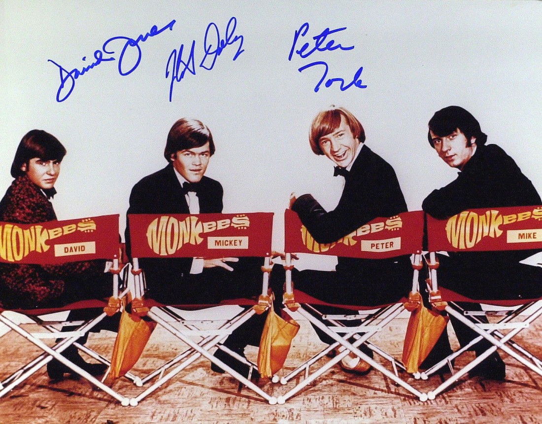 THE MONKEES - Large Photo Signed: The Monkees. The Monkees were a made for television musical group formed in 1965 for the television series The Monkees, which aired from 1966 to 1968, the musical acting quartet was composed of Micky