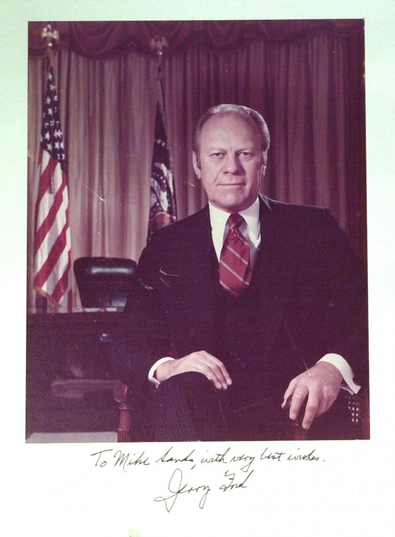 GERALD R FORD - Official WH Color Photograph: Gerald R. Ford. 8" x 10" color official presidential portrait mounted on 11" x 14" mat board and signed on the mount under the photograph: "To Mike Sands, with very best wishes. Jerry Ford." Some scra