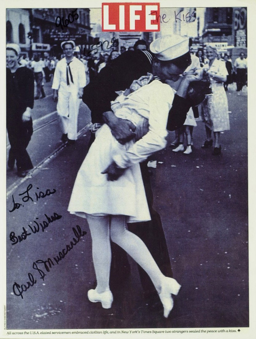 V-J Day - Times Square "THE KISS" - Three Signed I: The Kiss" V-J Day in Times Square. "The Kiss" is a photograph by Alfred Eisenstaedt that portrays an American sailor kissing a young nurse in a white dress on V-J Day in Times Square on August 14, 194