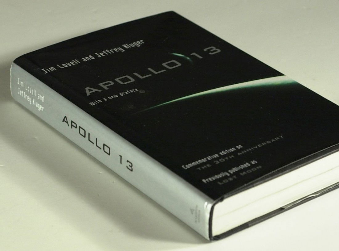 Apollo 13 JAMES LOVELL - His Book Signed: James Lovell (1928- ) Astronaut. Lovell was the commander of the Apollo 13 mission, which suffered a critical failure en route to the Moon but was brought back safely to Earth by the efforts of the cr