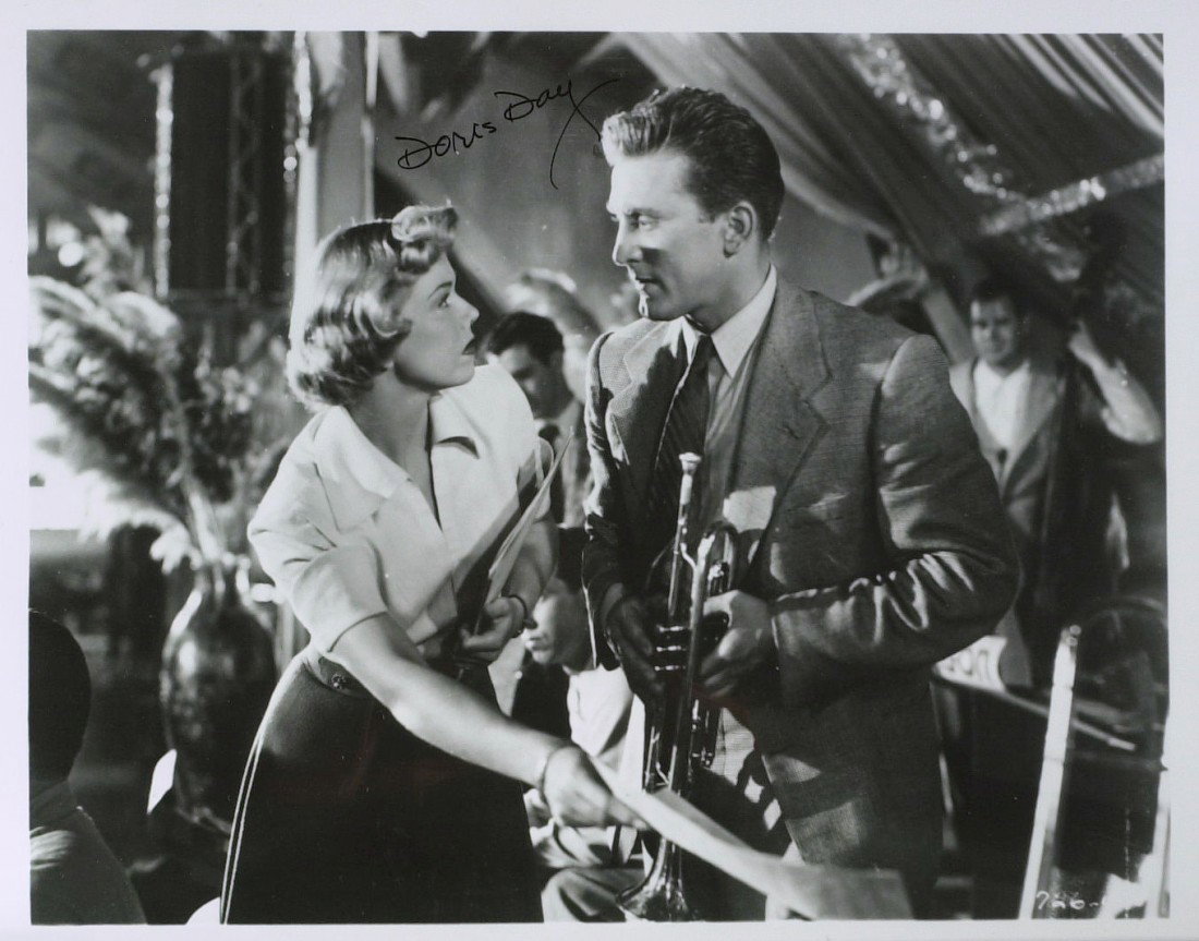 Actress DORIS DAY - Two Photos Signed: Doris Day (1922- ) Actress. Day made her film debut in 1948 and starred in musicals such as Calamity Jane, Young at Heart, and The Pajama Game. Playing a sunny, wholesome girl-next-door type, she embo