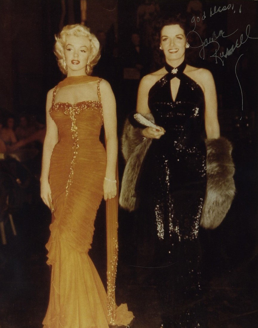 Actress JANE RUSSELL - Photo With Marilyn Monroe: Jane Russell (1921-2011) Actress. Russell made her motion picture debut in The Outlaw 1n 1941, a story about Billy the Kid that went to great lengths to showcase her voluptuous figure. The release of 