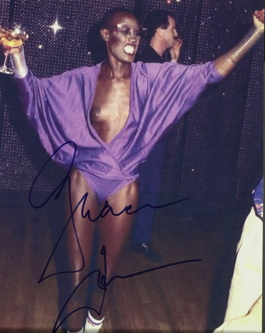 GRACE JONES - Wardrobe "Malfunction" Photo Signed: Grace Jones (1952- ) Jamaican born singer, actress. Jones secured a record deal with Island Records in 1977, which resulted in a string of dance-club hits. In the late 1970s, she adapted the emerging 