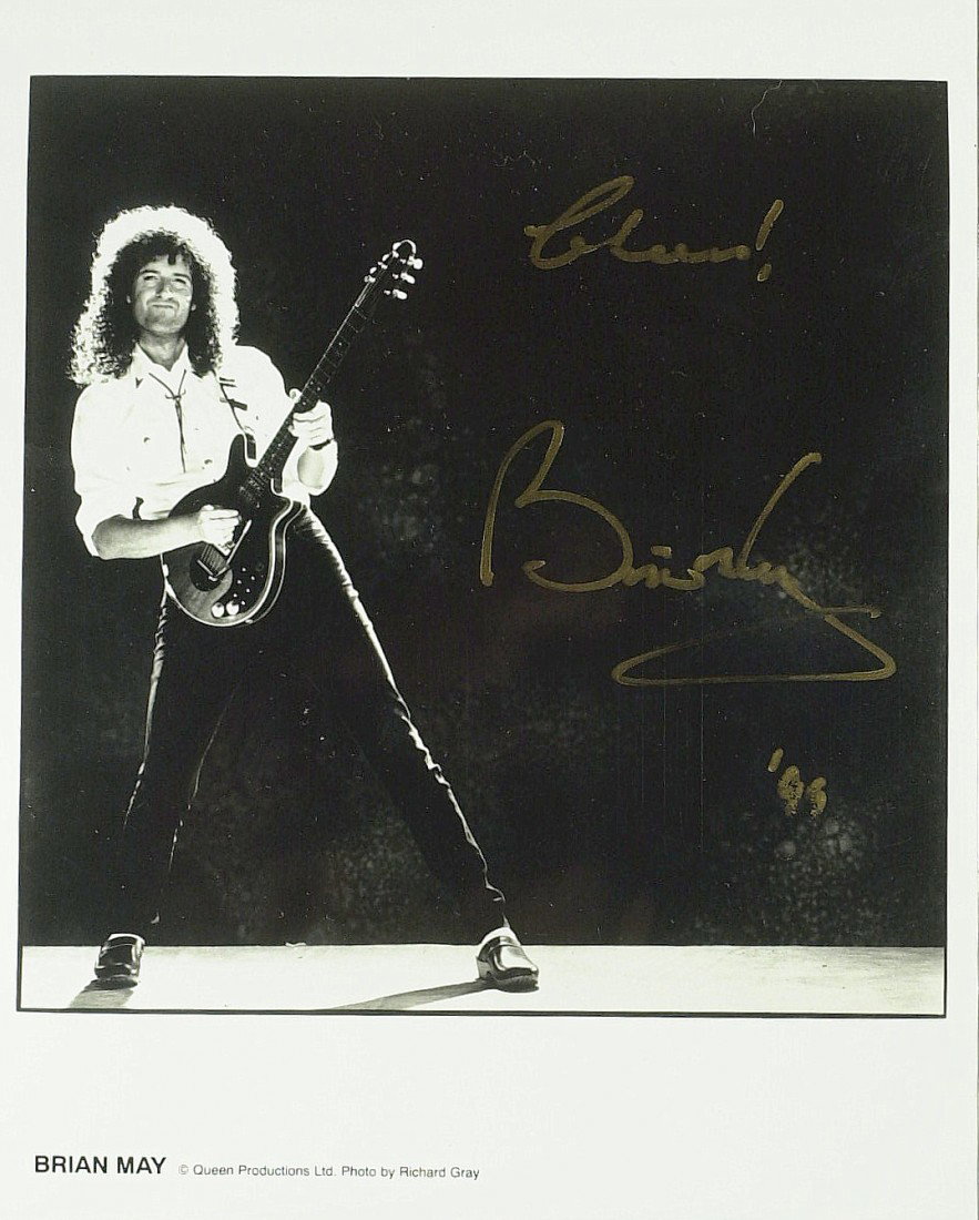 Queen Guitarist BRIAN MAY - Photo Signed: Brian May (1947- ) British musician. May is most widely known as the guitarist and a songwriter of the rock band Queen. As a guitarist he uses his home-built guitar, "Red Special", and has composed hi