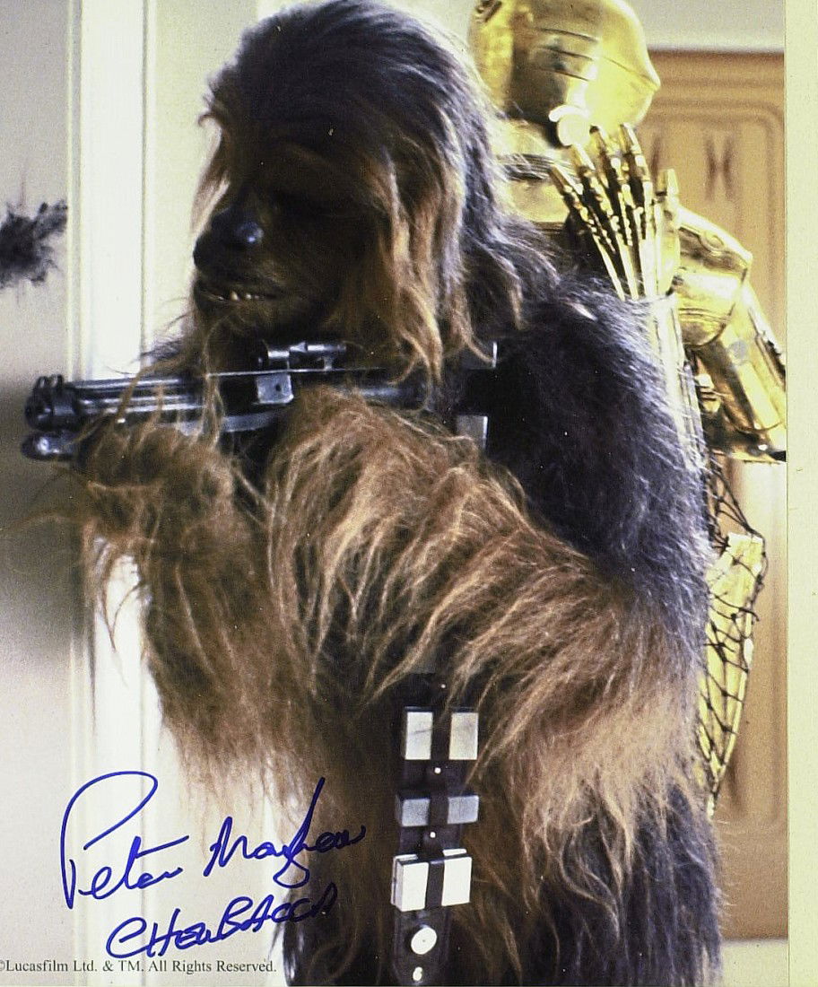Star Wars: PETER MAYHEW-Chewbacca Photo Signed: Star Wars: Peter Mayhew (1944- ) Mayhew's career in film has been all about his size. Over seven feet tall, he was just what George Lucas was looking for when casting the part of hairy sidekick Chewba