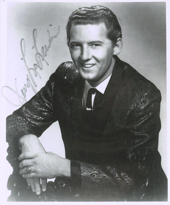 Rock Pioneer JERRY LEE LEWIS - Photo Signed: Jerry Lee Lewis (1935- ) Singer. Lewis was early pioneer of rock and roll music, Lewis had hits in the late 1950s with songs such as Great Balls of Fire, Whole Lotta Shakin' Goin' On, Breathless and H