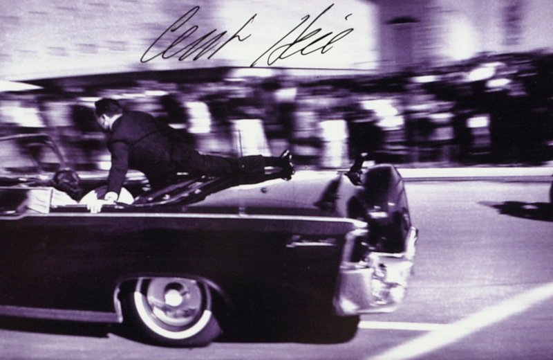 JFK Assassination CLINT HILL - Photo Signed: Kennedy Assassination: Clint Hill (1932- ) secret Service agent. Hill was in the presidential motorcade during the assassination of John F. Kennedy. After Kennedy was shot, Hill ran from the car immed