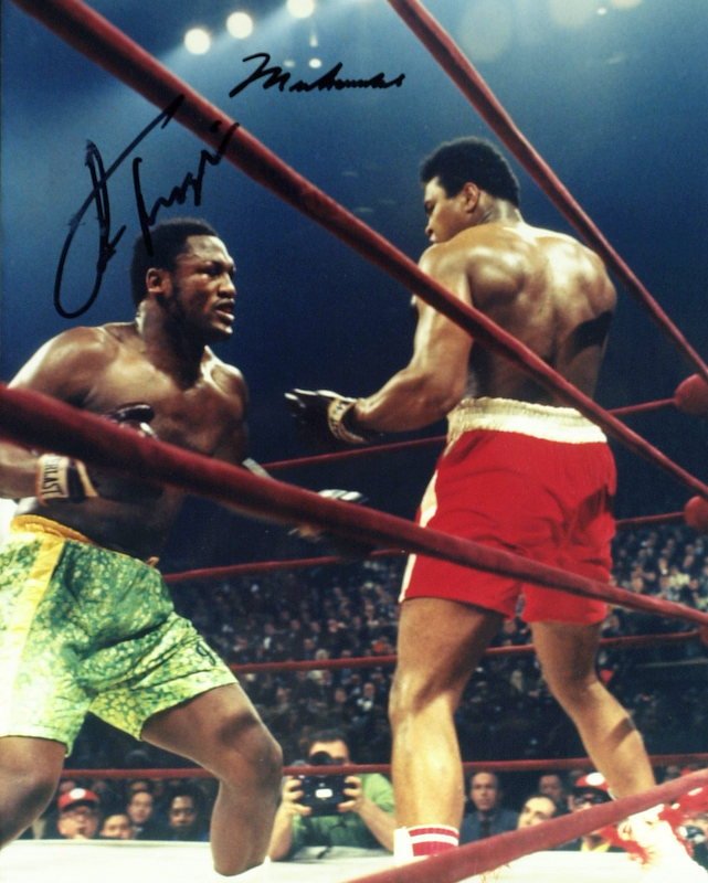 MUHAMMAD ALI & JOE FRAZIER - Fight Photo Signed: Muhammad Ali and Joe Frazier (1944-2011). The two are forever linked, thanks to their three timeless bouts, Frazier won only the first, and the third in Manila was a near-death experience for both of 