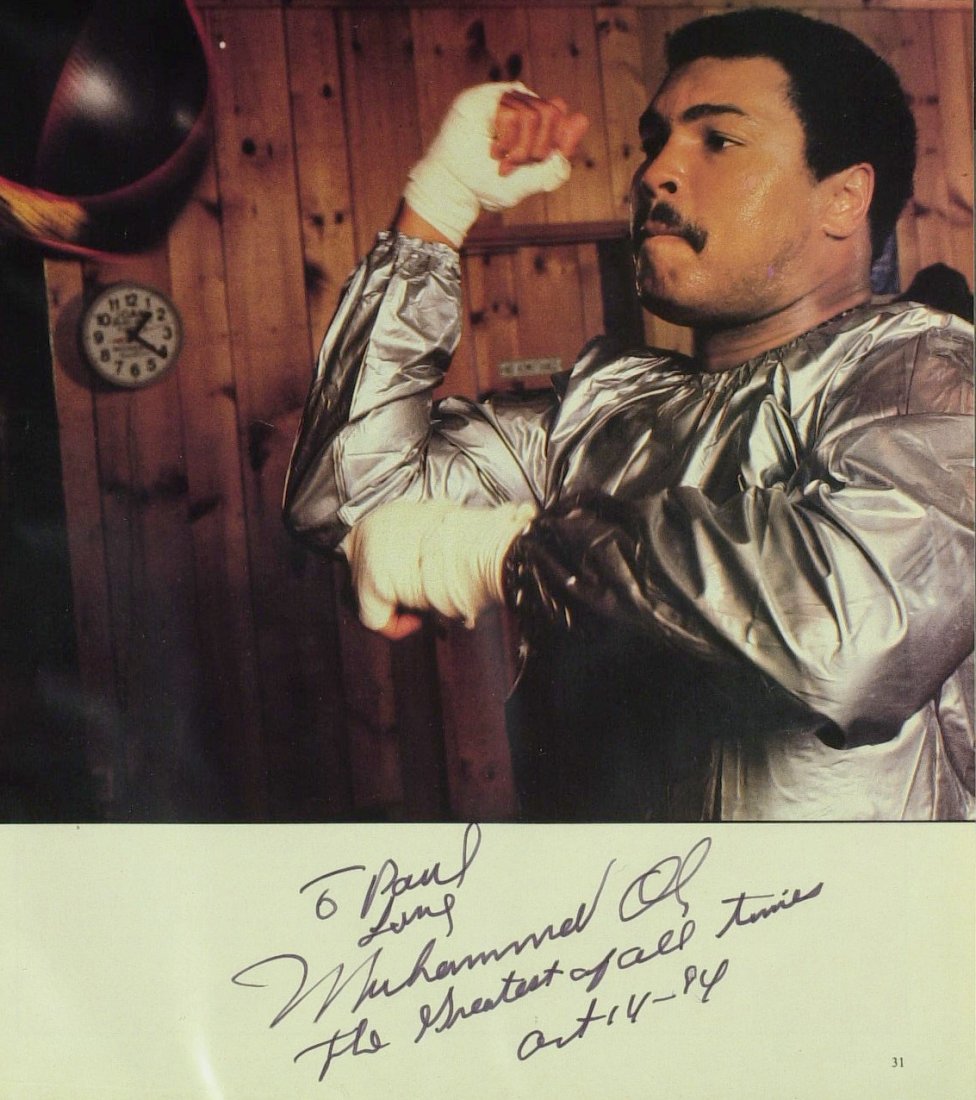 The Greatest MUHAMMAD ALI - Photo Signed: Muhammad Ali. 8” x 11” color magazine photograph (image 8” x 8 ½”) signed in the lower margin, “To Paul Love Muhammad Ali The Greatest of all times Oct 14 – 84.”