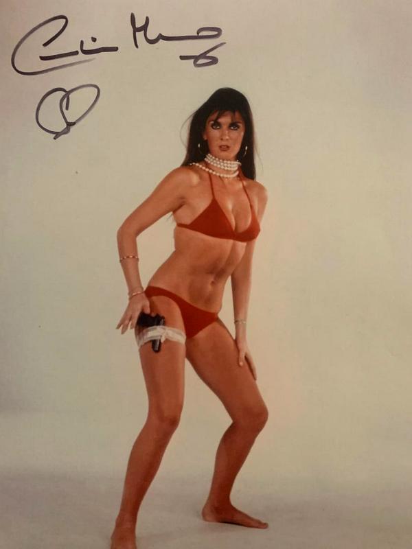 Munro,Caroline Signed Photo: Caroline Munro (1949) is an English actress, model and singer known for her many appearances in horror , science fiction and action films of the 1970s and 1980s. Signed 8”x10” color photo.