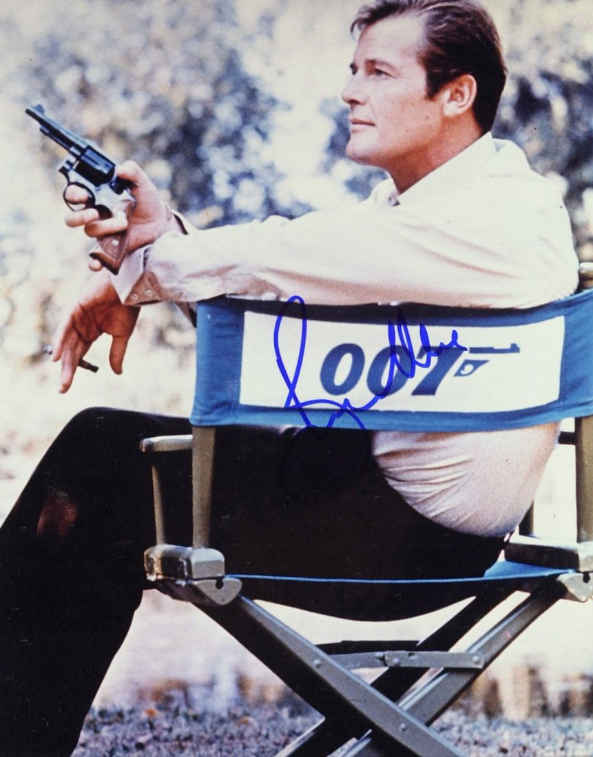 James Bond Actor ROGER MOORE - Photo Signed: James Bond: Roger Moore (1927- ) British actor. Moore is best known for his role as James Bond in the official film series between 1973 and 1985, as Simon Templar in The Saint between 1962 and 1969, a