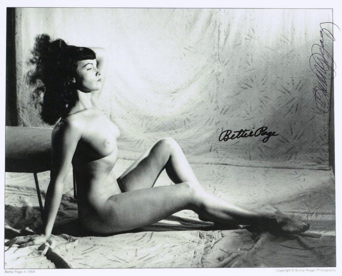 BETTIE PAGE - Nude Photo Signed also BUNNY YEAGER: Bettie Page. 10” x 8” black and white photograph, “Bettie Page in 1954”, nude, signed. The photograph has also been signed by photographer Bunny Yeager.