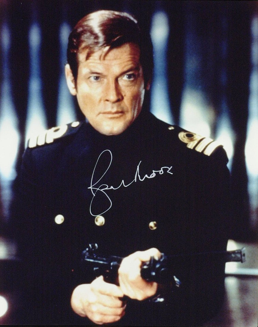 James Bond: ROGER MOORE - Photo Signed: James Bond: Roger Moore (1927- ) British actor. Moore is best known for his role as James Bond in the official film series between 1973 and 1985, as Simon Templar in The Saint between 1962 and 1969, a