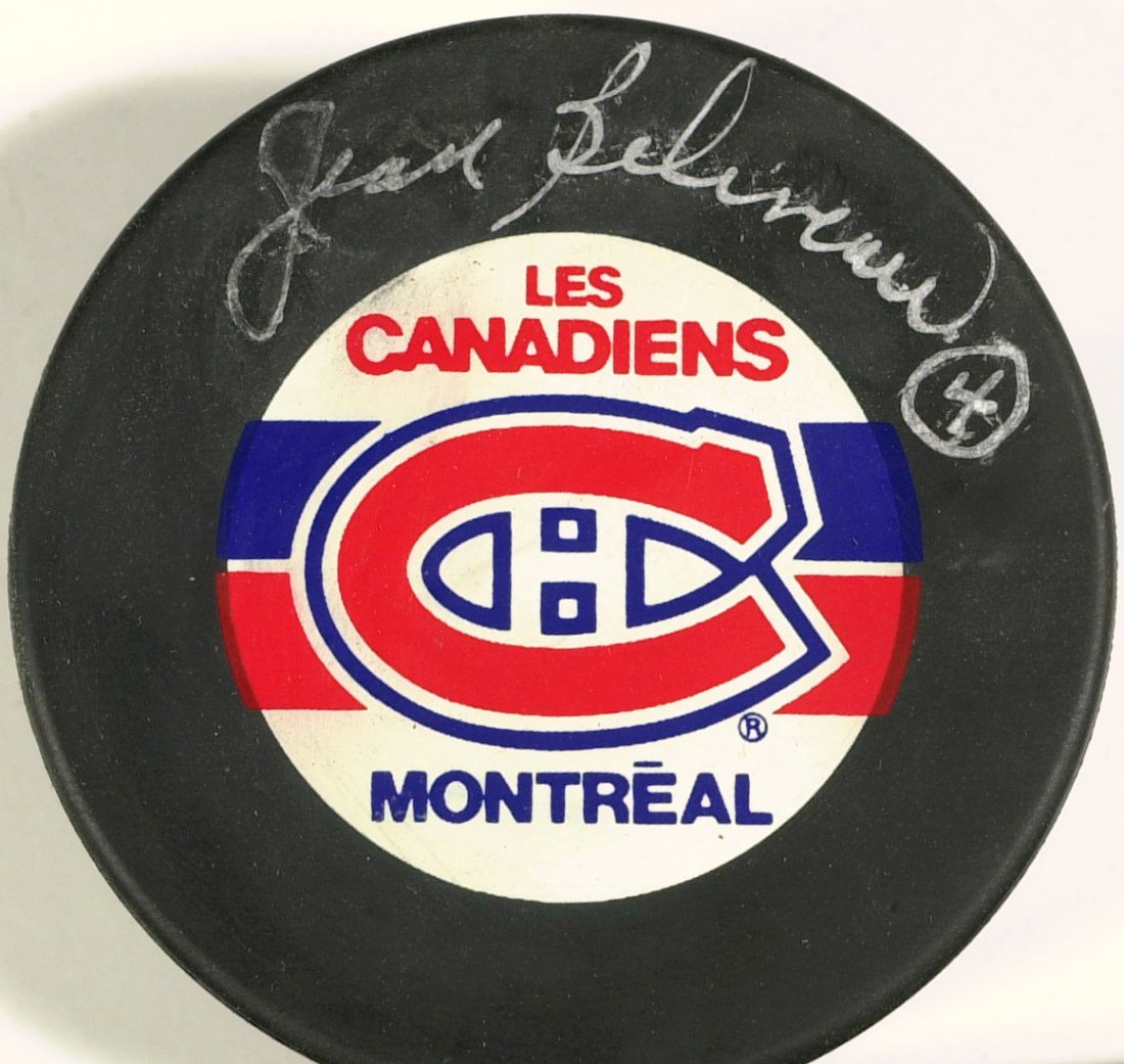 Canadien JEAN BELIVEAU - Puck Signed: Jean Beliveau (1931- ) Canadian hockey player. Beliveau played parts of 20 seasons with the National Hockey League's Montreal Canadiens. As a player, he won the Stanley Cup 10 times, and as an executi