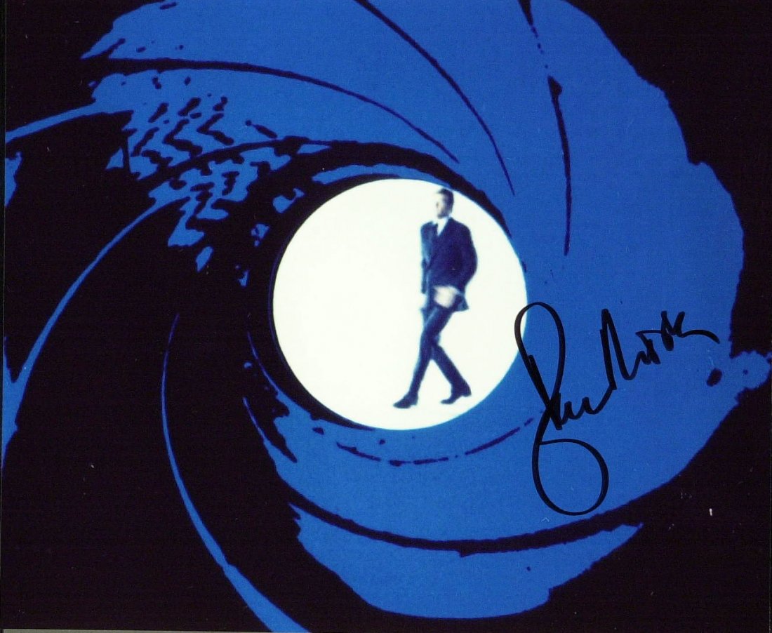 Actor ROGER MOORE - James Bond Photo Signed: James Bond: Roger Moore. 10” x 8” color gun barrel photograph with James Bond, signed.