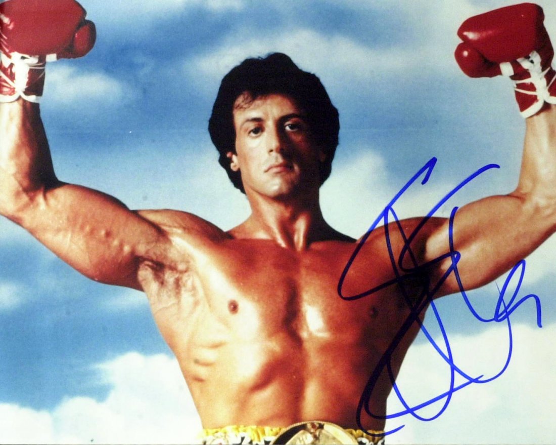 Actor SYLVESTER STALLONE - Rocky Photo Signed: Sylvester Stallone (1946- ) Actor. Stallone is well known for his Hollywood action roles. Two notable characters he has portrayed are the boxer Rocky Balboa and soldier John Rambo. 10” x 8” color 