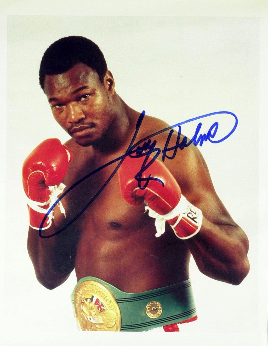 Hvywgt Champ LARRY HOLMES - Photo Signed: Larry Holmes (1949- ) Heavyweight champion. Holmes, whose left jab is considered one of the greatest weapons in the history of sports, was the WBC Heavyweight Champion from 1978 to 1983, The Ring Heav