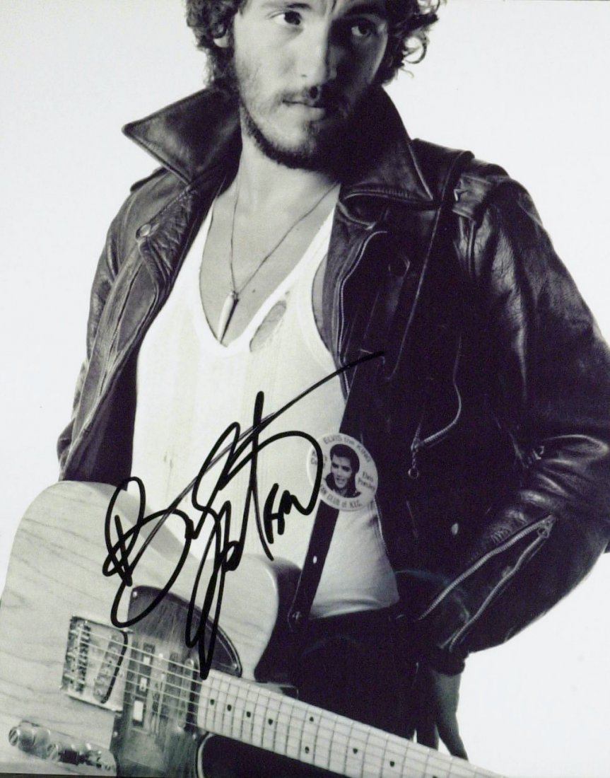 "The Boss" BRUCE SPRINGSTEEN - Photo Signed: Bruce Springsteen (1949- ) Singer, songwriter. Springsteen played guitar in several bar bands on the Jersey Shore before forming the E Street Band in the early 1970s. His third album, Born to Run, was
