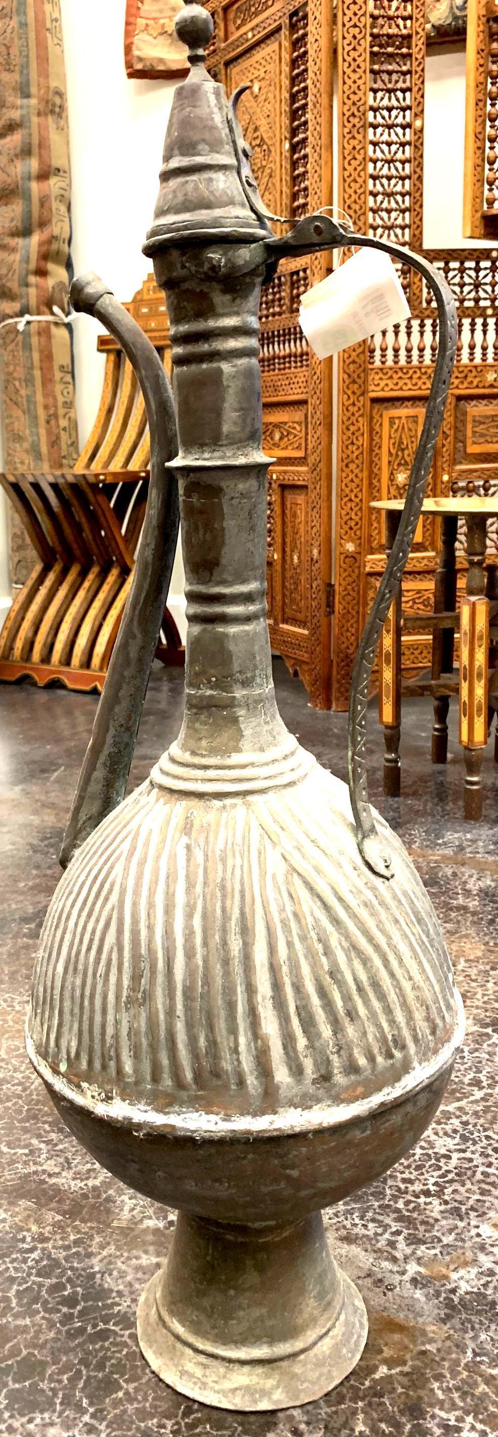 Middle Eastern Antique Metal Pitcher.: Middle Eastern Antique Metal Pitcher. 31 1/2 by 5 7/8 in.; 80 by 15 cm.