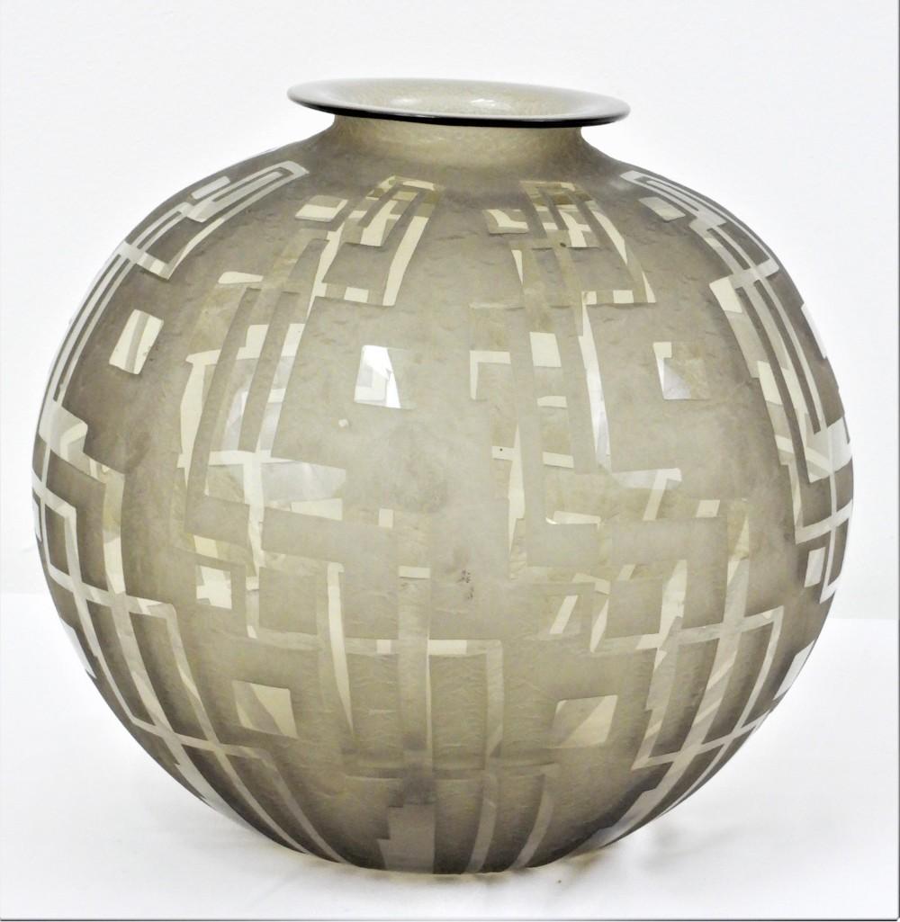 Daum - Vase: Daum - Vase France - Around 1930 - Glass Ball vase with flared neck, slightly smoky glass with an acid-edged geometric decor. Signed â€œDaum Nancy France”. Vase Daum ,Material Glass, Estimat
