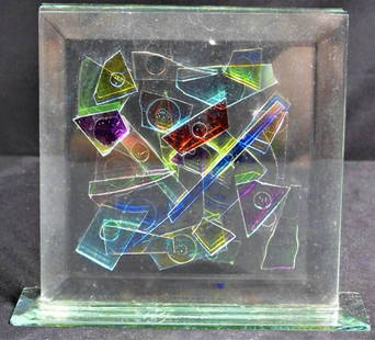 Jan Cassidy. Modernist plexiglass sculpture.: Jan Cassidy (American). Modernist plexiglass sculpture. Depicts various colored glass layered together on a base.. Small chip to the base. DIMENSIONS: Height: 5.20 inch / 13 cm 