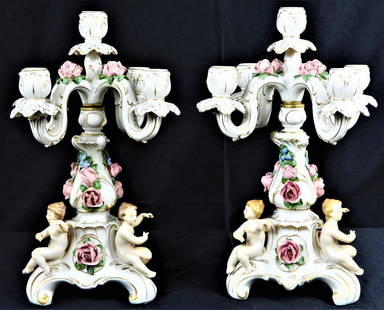 Pair of Dresden five arm candelabras with floral decorations .: Pair of Dresden five arm candelabras with floral decorations . Hand painted with floral encrusted. Dresden hallmark is on each base. Candelabra is made of two pieces, a base and upper portion with