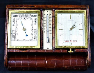 Jaeger Le Coultre travelling Alarm Clock barometer, thermometer.: JAEGER LECOULTRE Barometer Travel Alarm Clock Barometer Thermometer. Mechanical movement 8 days.Crocodile sheathing DIMENSIONS: Height:4.75 inch / 12 cm Length: 6.25 inch / 16 cm